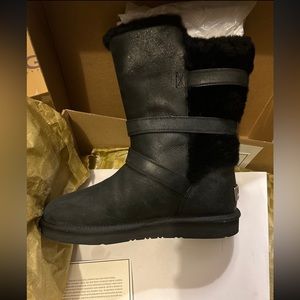 Ugg black boots with 3 buckles on the side in silver tone hardware. New with box
